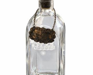 Rectangular glass decanter with rounded stopper.