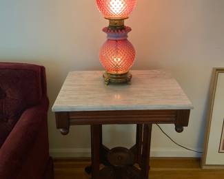 Victorian marble top table and cranberry glass lamp