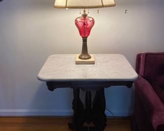 Victorian marble top table and cranberry glass lamp