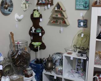 Macrame hoops, silver teapot, candy jars, vintage camera, Christmas miniatures, wall shelves