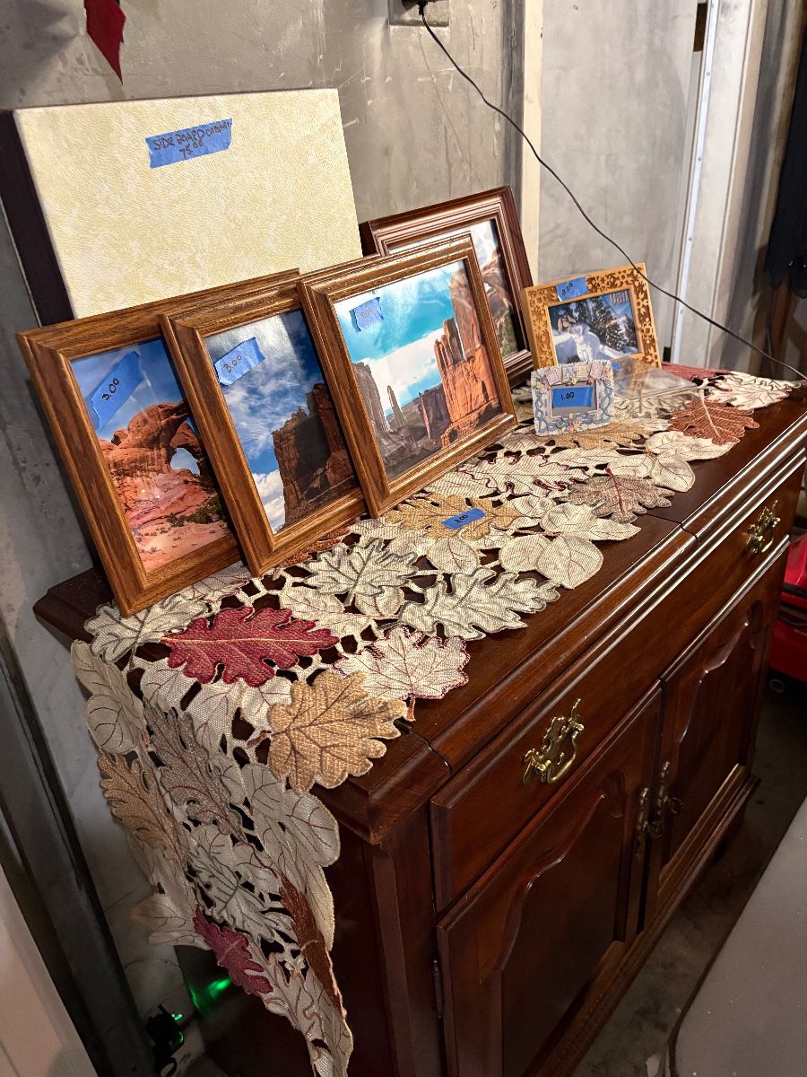 Side board miscellaneous framed pics 