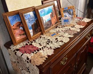 Side board miscellaneous framed pics 