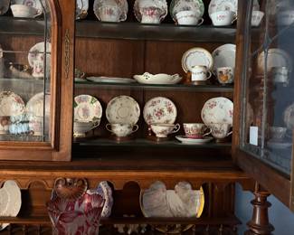 English Buffet Cabinet filled with antique tea cups and saucers