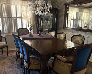 antique dining set complete with pads. upholstered tapestry chairs with blue velvet backs.  Crystal cabinet filled with treasures.