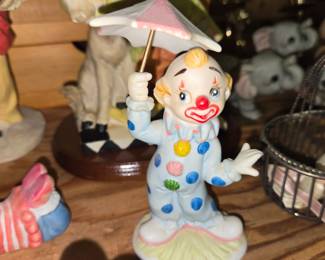 vintage Lefton porcelain clown figurine holding a pink-and-white striped umbrella