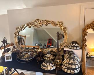 Vintage Hollywood Regency Antiqued Gold Finish Wall Mirror by Bassett & light fixtures in Tiffany Style