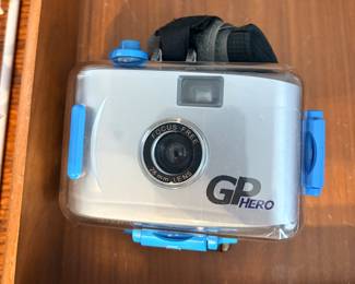 original GoPro Hero 35mm film camera released in 2004, enclosed in its clear waterproof housing