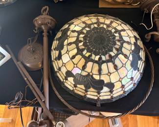 Tiffany-style stained glass inverted dome or hanging lamp shade featuring a spiderweb and floral motif with amber-toned jewels