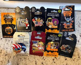 collection of Disney trading pins on their original backing cards, featuring several limited-edition Mickey's Not-So-Scary Halloween Party pins from 2009 and 2010