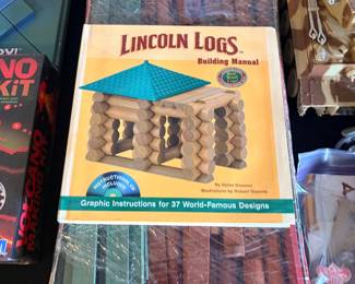boxed set of Lincoln Logs bundled with the Lincoln Logs Building Manual by Dylan Dawson and illustrated by Robert Steimle