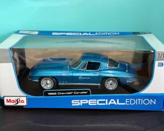 shows a 1:18 Scale 1965 Chevrolet Corvette diecast model car 