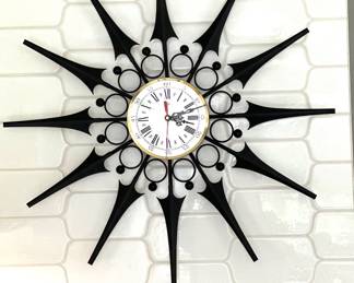 Black sunburst wall clock