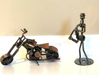 Miniature metal motorcycle and saxophone player sculptures