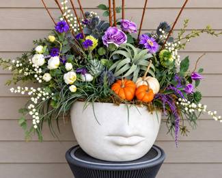 concrete face planter featuring a sculpted nose and lips purchased from Gerych's