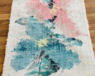 Several handmade rugs purchased from an art fair