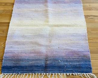 Variety of handmade rugs purchased from an art fair