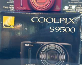 Red Nikon COOLPIX S9500 compact digital camera