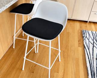 Knoll Muuto counter height bar stools with black leather Knoll seat cushions
