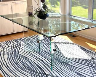 Contemporary rectangular area rug featuring an abstract linear pattern
