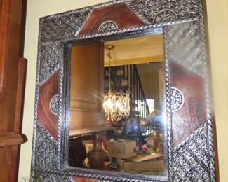 Hand hammered tin framed mirror.