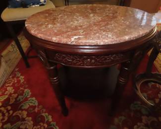 Pink/salmon marble topped iend table.