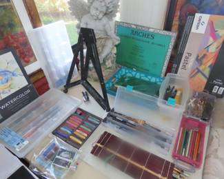 Art supplies, paper,brushes, canvasses, paints and paint books.