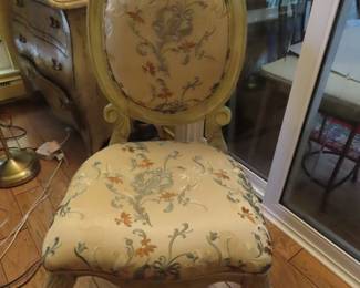 One of two silk bedroom chairs.