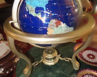 Table top globe with stone inlays.