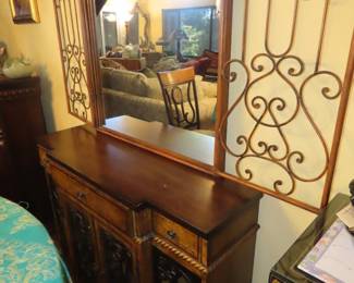 Hall entry cabinet/bar with mirror and iron side doors.