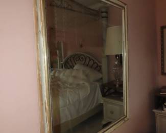 Large gold framed mirror.