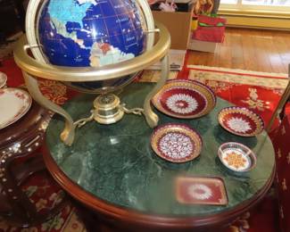 Green marble top end table, enameled dishes, table top globe with stone inlays.