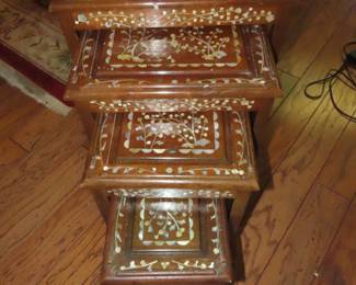 Nesting tables with bone like/ivory inlays.