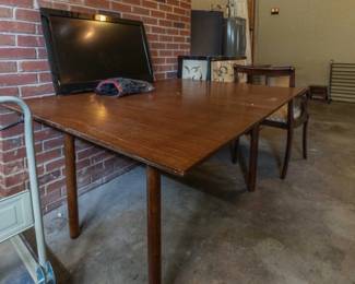Wood table that folds to half size.