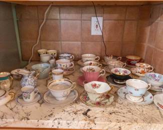 Large assortment of tea cups