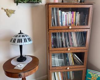 Barrister style cabinet and antique clawfoot table