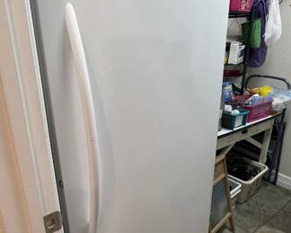 Modern Frigidaire upright freezer in white finish.