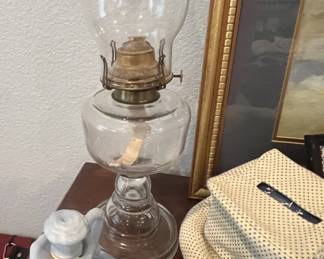 Vintage clear glass oil lamp with a brass burner assembly