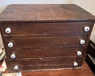 Antique wooden tabletop spool cabinet or organizer chest.
