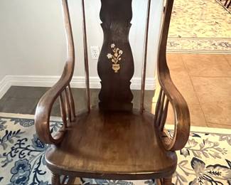 Vintage wooden rocking chair featuring a hand-painted landscape medallion on the crest rail and a floral motif on the splat.