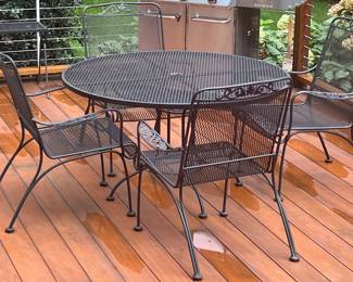 87. Wrought Iron Round Table (48") w/ 4 Arm Chairs