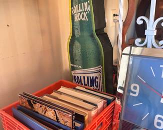 Rolling rock beer sign, books