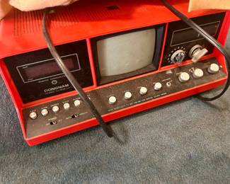 vintage red tv with AM/FM radio