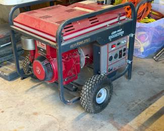 GMI Gen-Pro 6000-watt brushless portable generator with a Briggs & Stratton engine, mounted on a wheeled cart frame.