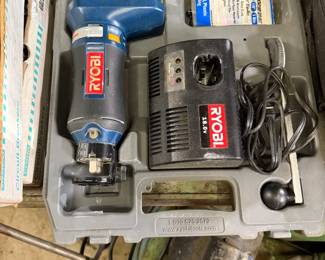 Ryobi 18V rotary tool kit in its original gray plastic carrying case, including the tool, battery charger, and accessories.