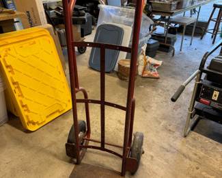 Vintage red Sears Craftsman hand truck, model 165.87217, showing some wear and rust from use.