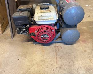 Senco air compressor powered by a Honda GX120 4.0 horsepower gas engine, showing signs of moderate use and wear.
