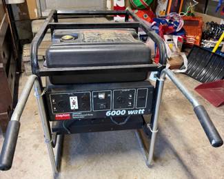 Dayton portable generator powered by a red Honda 11.0 HP engine, mounted on a wheeled black metal cart frame.