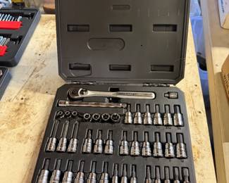 Craftsman socket and bit driver set in a black plastic molded carrying case, showing a ratchet, extension bar, and various hex and Trox bits.