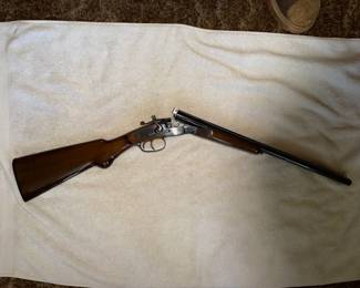 Amadeo Rossi S.A. double-barrel shotgun, imported by The Garcia Corp., featuring a blued finish and dual external hammers.