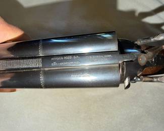 Amadeo Rossi S.A. double-barrel shotgun, imported by The Garcia Corp., featuring a blued finish and dual external hammers.